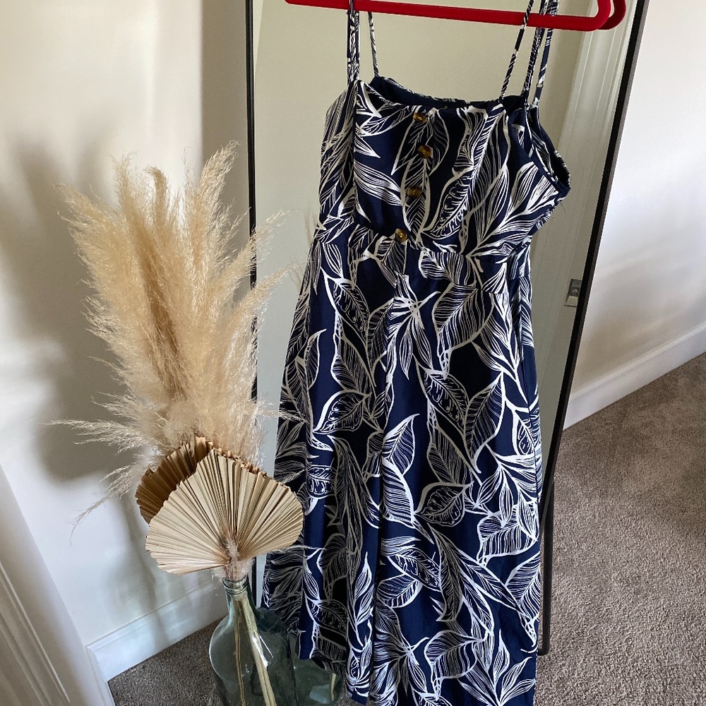 The Copper Closet | navy tropical jumpsuit with flared legs